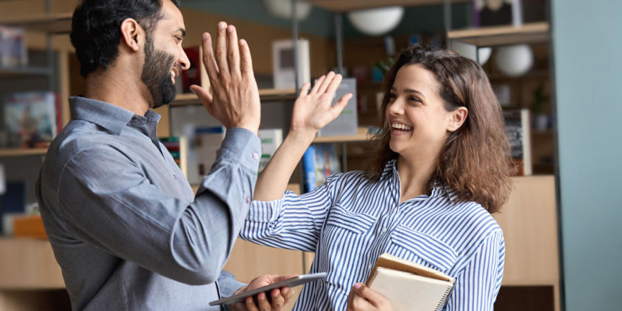 Instructor giving his trainee a high five | Aligning Your Training Program for Greater Impact